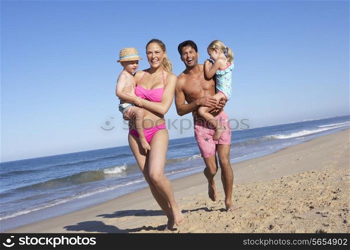 Family Having Fun On Beach
