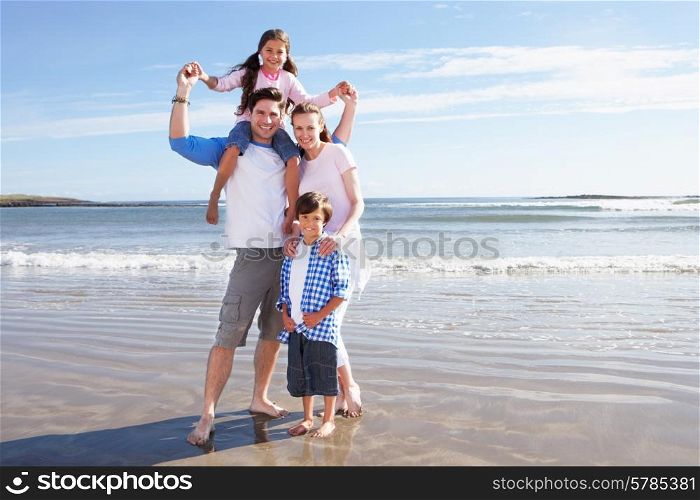 Family Having Fun On Beach Holiday
