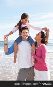 Family Having Fun On Beach Holiday