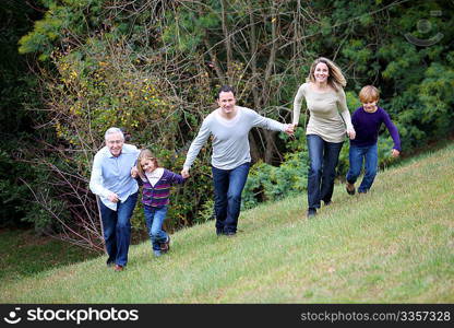 Family having fun running in park