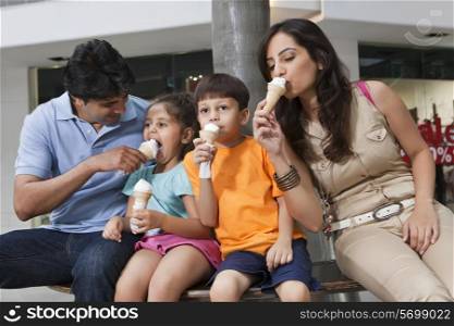 Family having great time together while eating ice cream