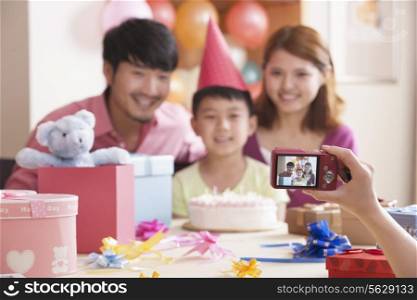 Family Having Their Picture Taken at Their Son&rsquo;s Birthday