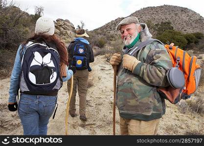 Family hiking in desert (portrait)