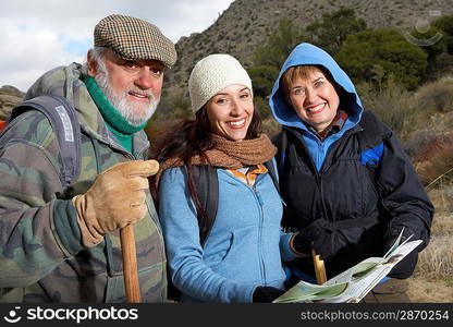 Family hiking in desert (portrait)