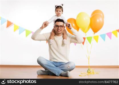 family, holidays and people concept - happy father and little daughter with helium balloons on birthday party. father and daughter with birthday party balloons. father and daughter with birthday party balloons