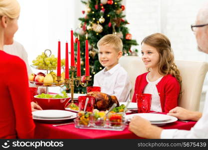 family, holidays, generation, christmas and people concept - smiling family having dinner at home