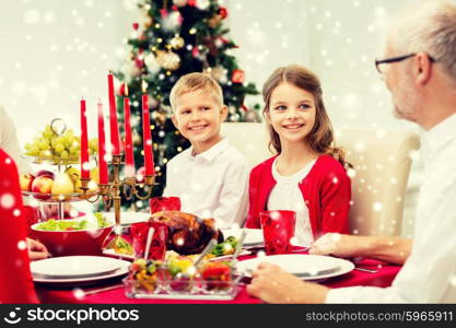 family, holidays, generation, christmas and people concept - smiling family having dinner at home