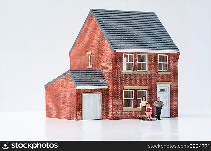 Family home concept with model house and people on white background