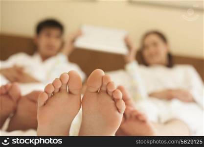 Family in Bed with Bare Feet