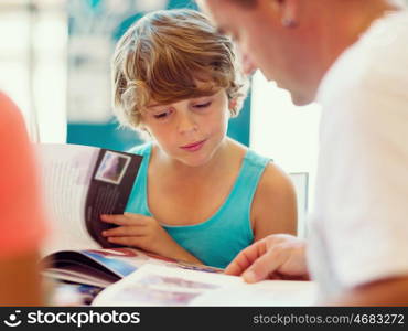 Family in library with books. Family in library