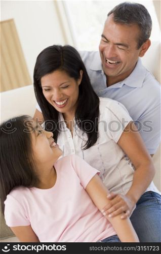 Family in living room smiling