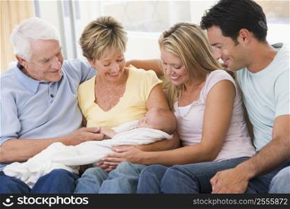 Family in living room with baby smiling
