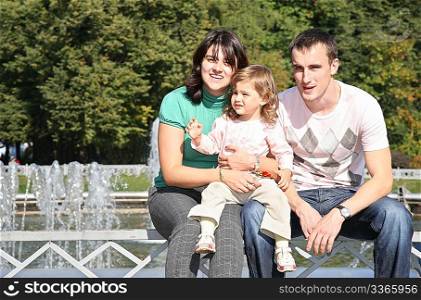 Family in park at fontain