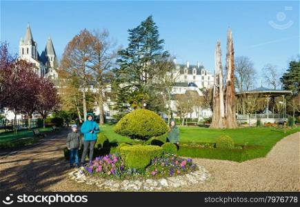Family in spring public park in Loches town (France).