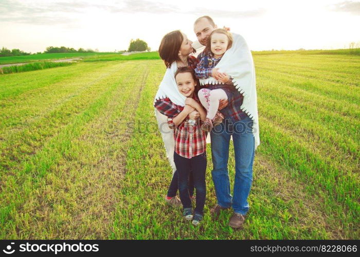 family in the field. Concept of happy family