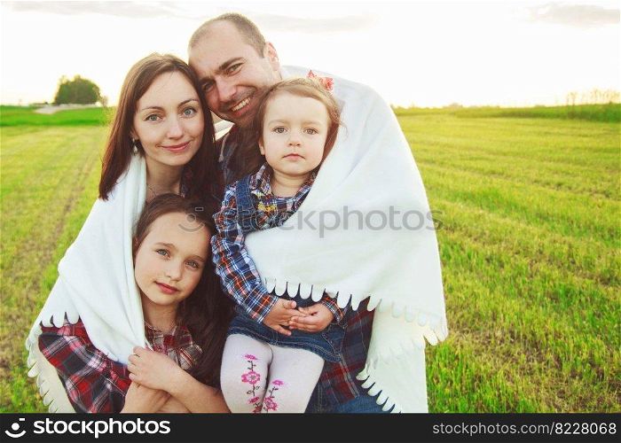 family in the field. Concept of happy family