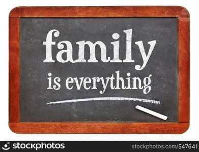 family is everything - white chalk text on a vintage slate blackboard. blackboard