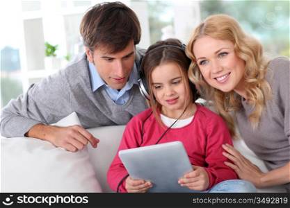 Family listening to music with tablet
