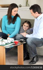 Family looking at a new-build model