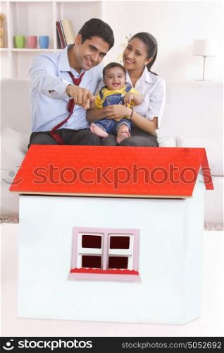 Family looking at model house