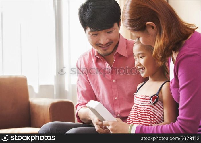 Family Looking at Picture Together