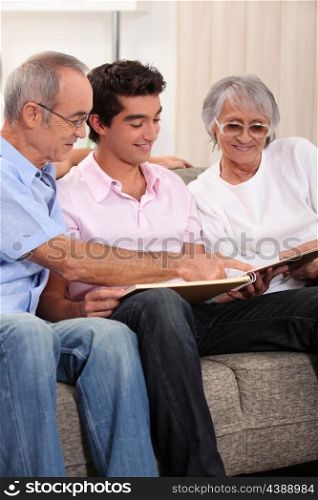 Family looking through photo album