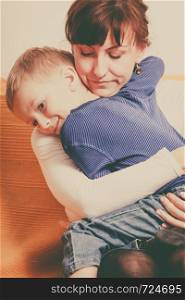 Family love, beauty of parenting concept. Mother hugging her son, little young boy.. Mother hugging her son, little boy