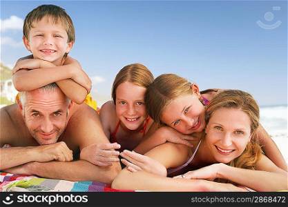 Family lying on beach