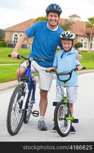 Family Man and Boy Child, Father & Son Cycling