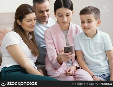family members using mobile phone