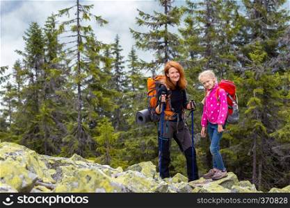 family - mother and daughter  hikers at the Carpathians mountains. gorgany, Ukraine. 