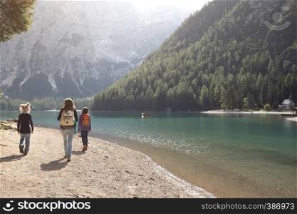 family. mother and her daughter walking around the Braies lake, Dolomites Italy