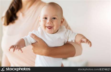 family, motherhood and people concept - close up of mother with little baby boy at home. close up of mother with little baby boy at home