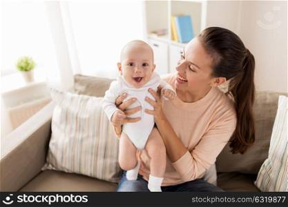 family, motherhood and people concept - happy mother with little baby boy at home. happy mother with little baby boy at home
