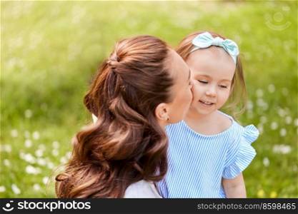 family, motherhood and people concept - happy mother with little daughter at summer park. happy mother with little daughter at summer park