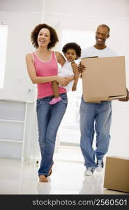 Family moving into new home smiling