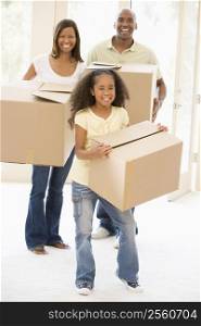 Family moving into new home smiling