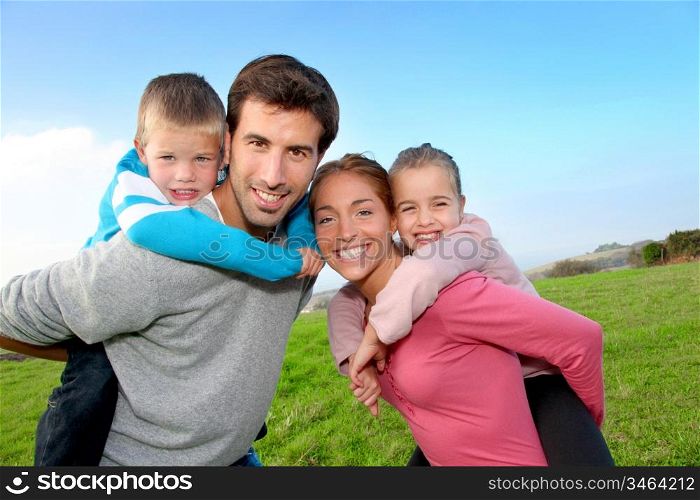 Family of 4 people in countryside