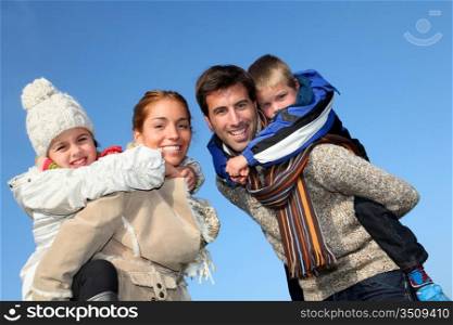 Family of 4 people in countryside