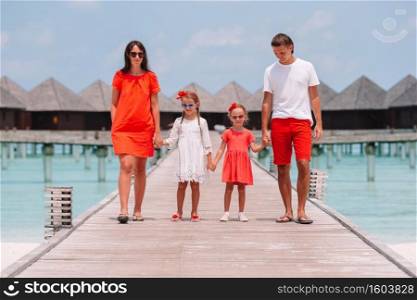 Family of four beach vacation. Happy family on a beach during summer vacation