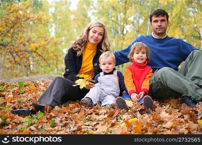 family of four in autumn park