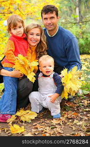 family of four in autumn park