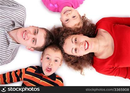 family of four lying on floor