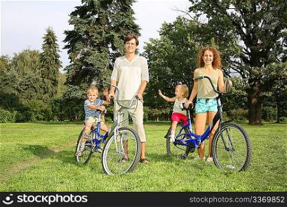 family of four with bikes