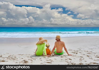 Family on beach, young couple with three year old boy. Summer vacation at Seychelles.