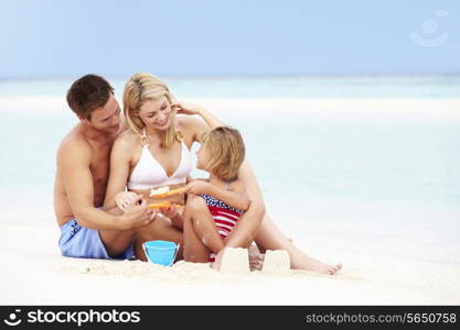 Family On Playing On Beautiful Beach