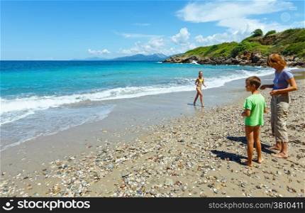 Family on summer beach (Greece, Lefkada, Ionian Sea).