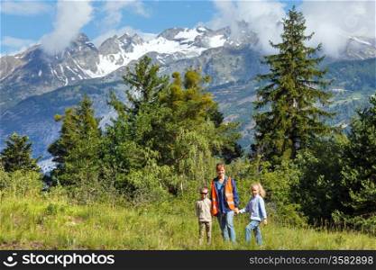 Family on summer mountain slope (Alps, Switzerland)