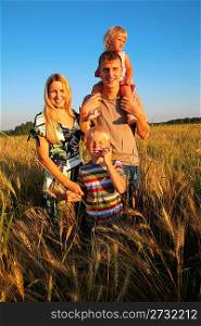 Family on wheaten field