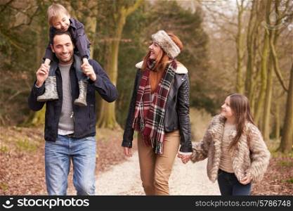 Family On Winter Countryside Walk Together